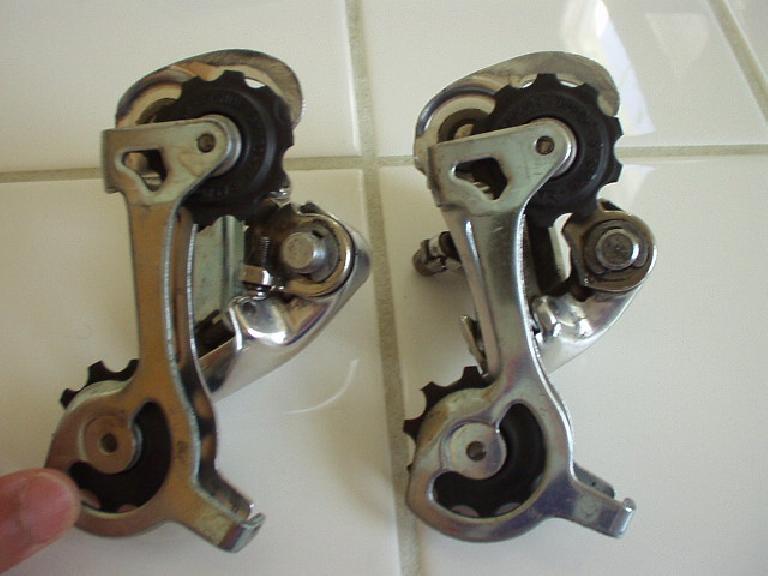 I was riding off-road (on my road bike, and a long piece of barbed wire got tangled in the rear wheel, seizing the wheel. When the wheel seized, the tension tab on the rear derailleur (Campagnolo Veloce, above right) broke off. (On the left is an identical, unbroken derailleur for comparison.) (June 12, 2004) I was riding off-road (on my road bike, and a long piece of barbed wire got tangled in the rear wheel, seizing the wheel. When the wheel seized, the tension tab on the rear derailleur (Campagnolo Veloce, above right) broke off. (On the left is an identical, unbroken derailleur for comparison.) (June 12, 2004)