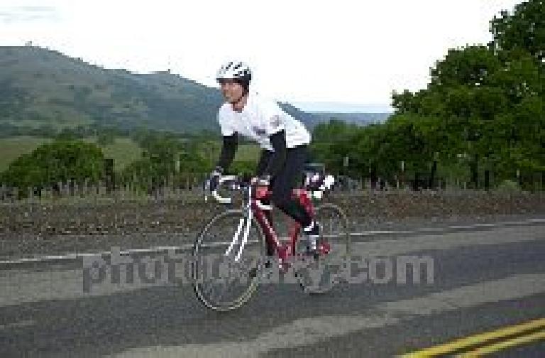 Mile 34, 7:12am: We get to Mines Rd., and the pack has now dispersed. Felix Wong attacks! (Photo courtesy of PhotoCrazy.com) Mile 34, 7:12am: We get to Mines Rd., and the pack has now dispersed. Felix Wong attacks! (Photo courtesy of PhotoCrazy.com)