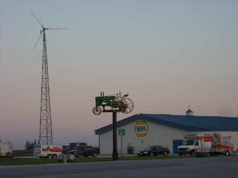 A windmill and lawn tractor by a Napa Auto Parks store not too far from Des Moines, Iowa. (August 11, 2011) A windmill and lawn tractor by a Napa Auto Parks store not too far from Des Moines, Iowa. (August 11, 2011)