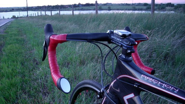 The Italian Road Bike Mirror installed on the handlebars is well integrated and aero. It's almost stealthy. (July 2, 2011) The Italian Road Bike Mirror installed on the handlebars is well integrated and aero. It's almost stealthy. (July 2, 2011)