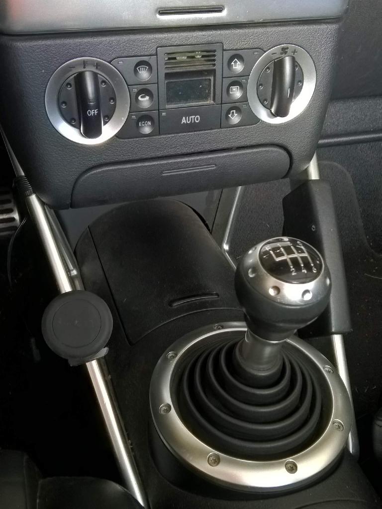 The Cellet magnetic phone mount after being installed in my 2001 Audi TT Roadster Quattro. Cellet magnetic phone mount, center console, gearshift knob, Audi TT
