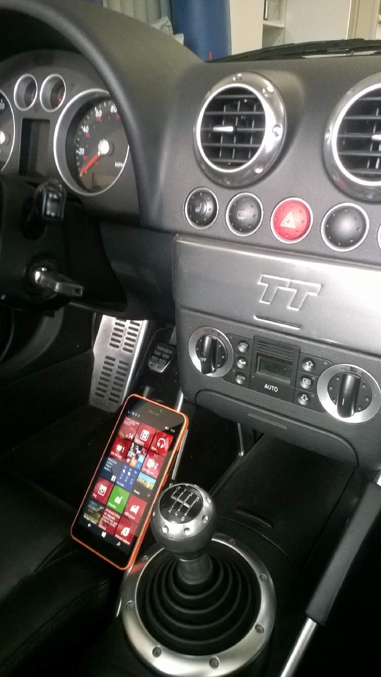A Microsoft Lumia 640 XL attached magnetically to the phone mount in my 2001 Audi TT Roadster Quattro. Microsoft Lumia 640 XL, center console side view, Audi TT