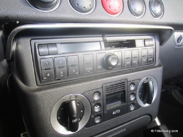 Detail of the cassette adapter installed. The wires stay out of the way and the radio cover can still be lower and raised without hindrance. Detail of the cassette adapter installed. The wires stay out of the way and the radio cover can still be lower and raised without hindrance.
