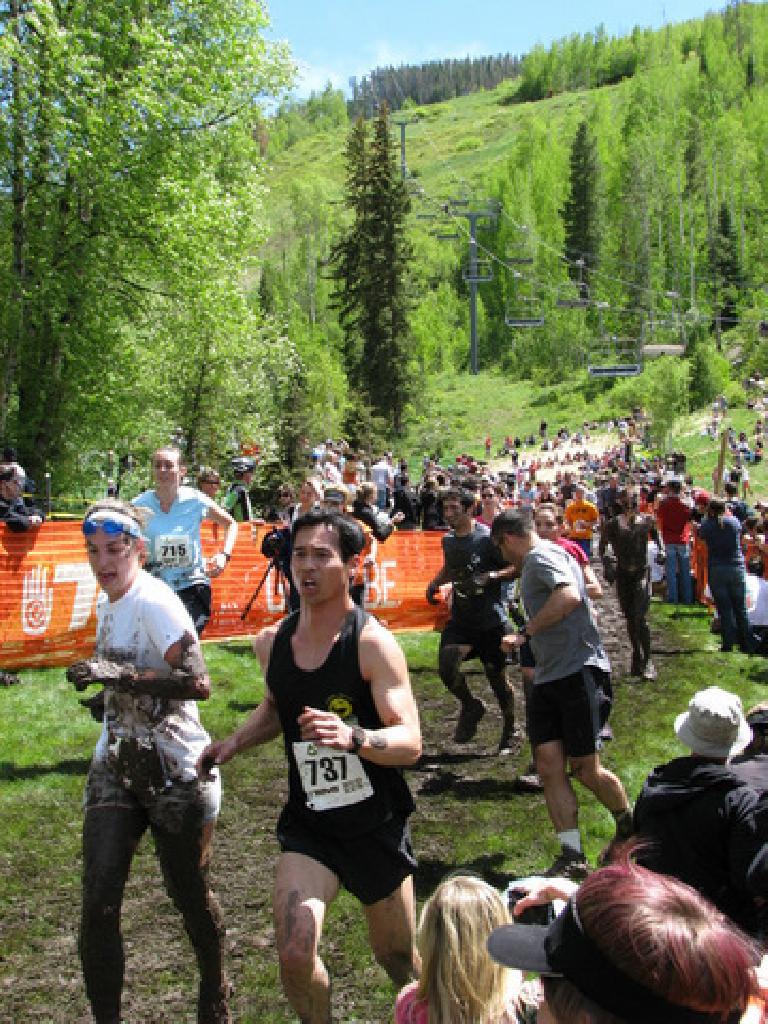 Lapping a very muddy person on Lap 3 of the Mud Run. Photo: Tori. Lapping a very muddy person on Lap 3 of the Mud Run. Photo: Tori.
