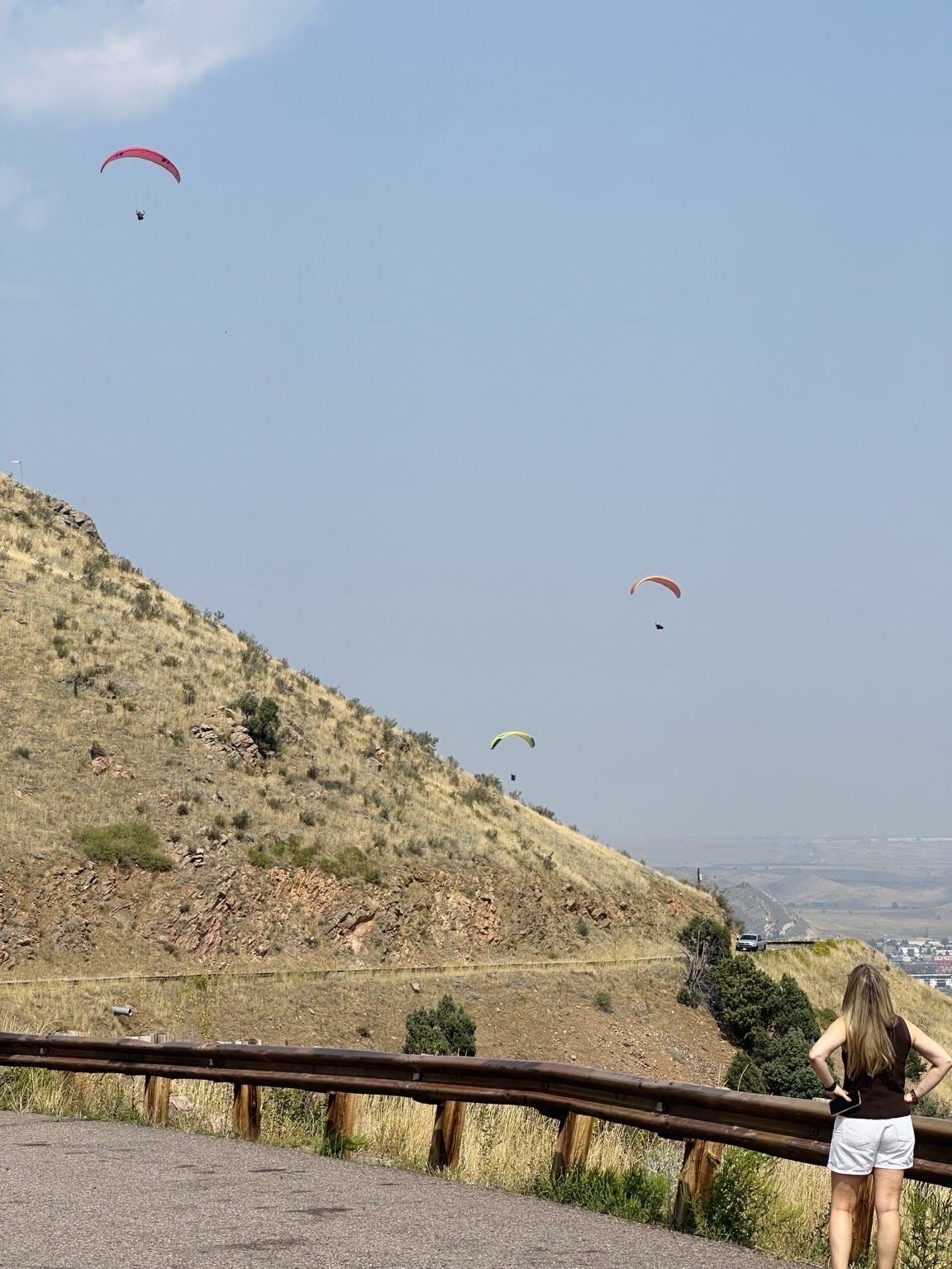Andrea watching the paragliders over Lookout Mountain in Golden, Colorado.
