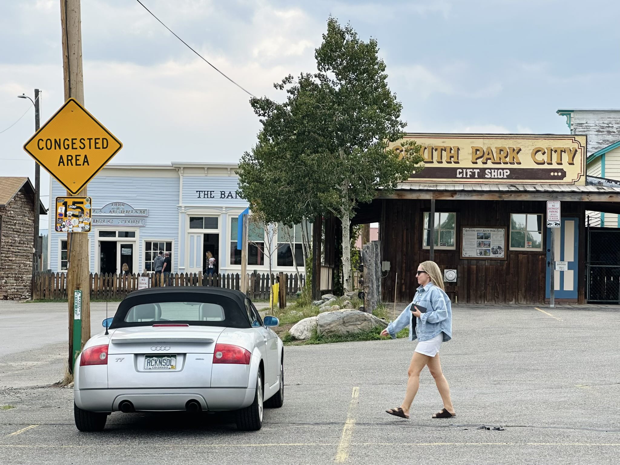 Andrea walks over to my Audi TT Roadster Quattro in South Park City. Amusingly, there was a "congested area" sign even though there were the only ones out on the street.