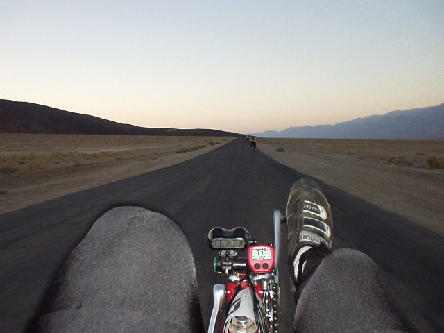 Mile 5, 6:13 a.m.: The view from my recumbent in the early going in the desert.  Note the speed (31.5 mph) I am going on almost-flat land.  I'd quickly catch the cyclists ahead, at least momentarily!