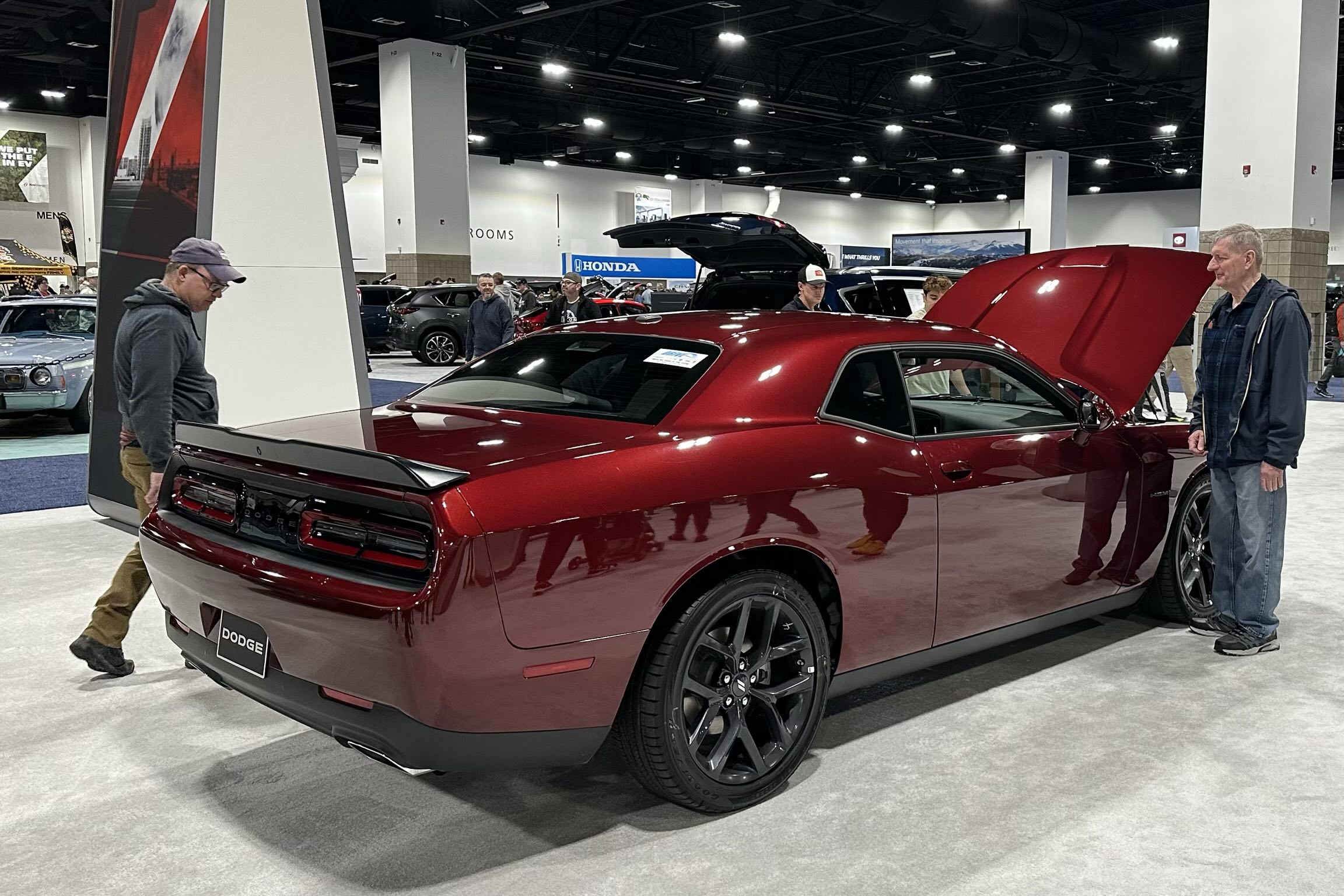 A red Dodge Challenger with a HEMI engine.