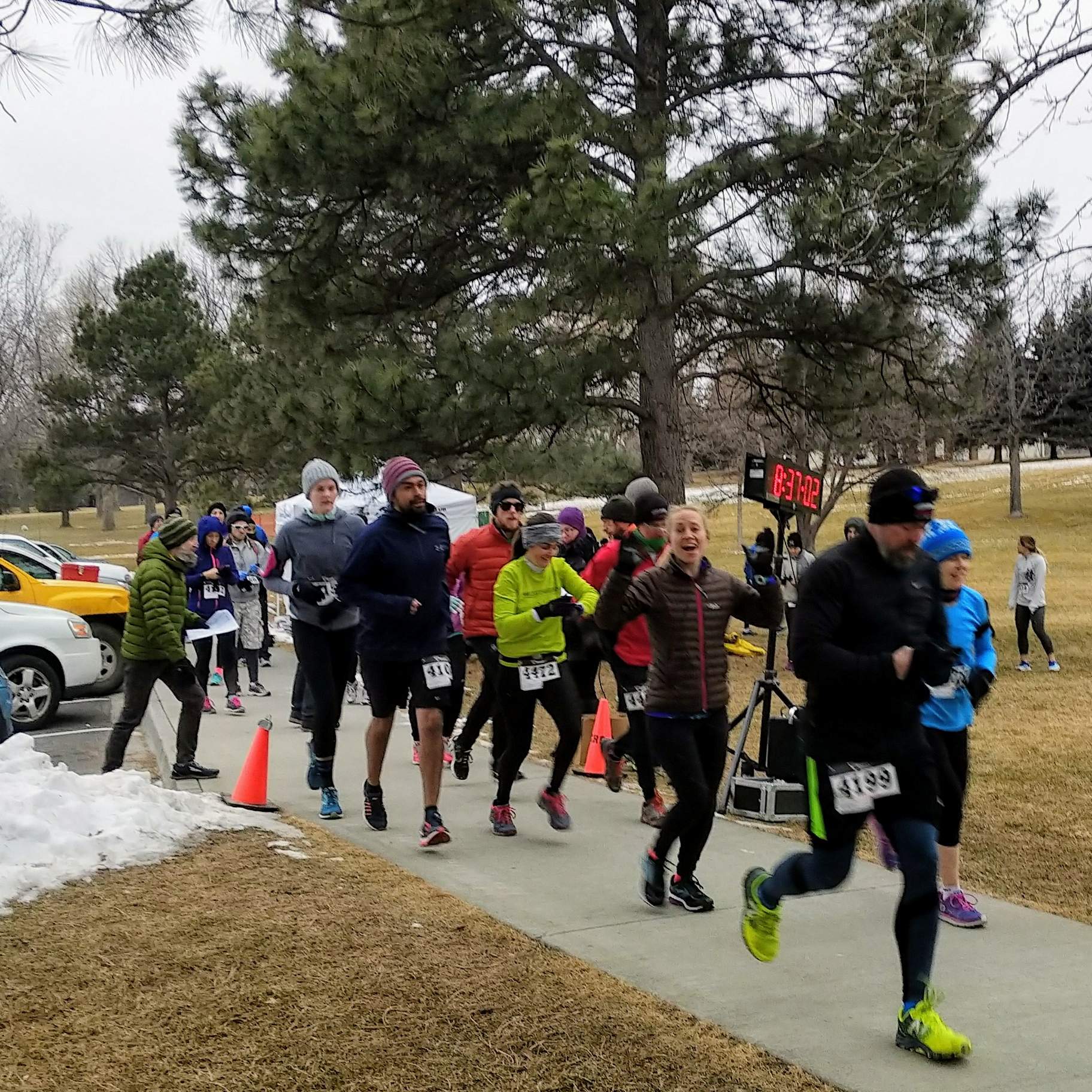 Runners starting their wave at the 2018 Edora Park 8-kilometer Tortoise & Hare race by the Fort Collins Running Club.