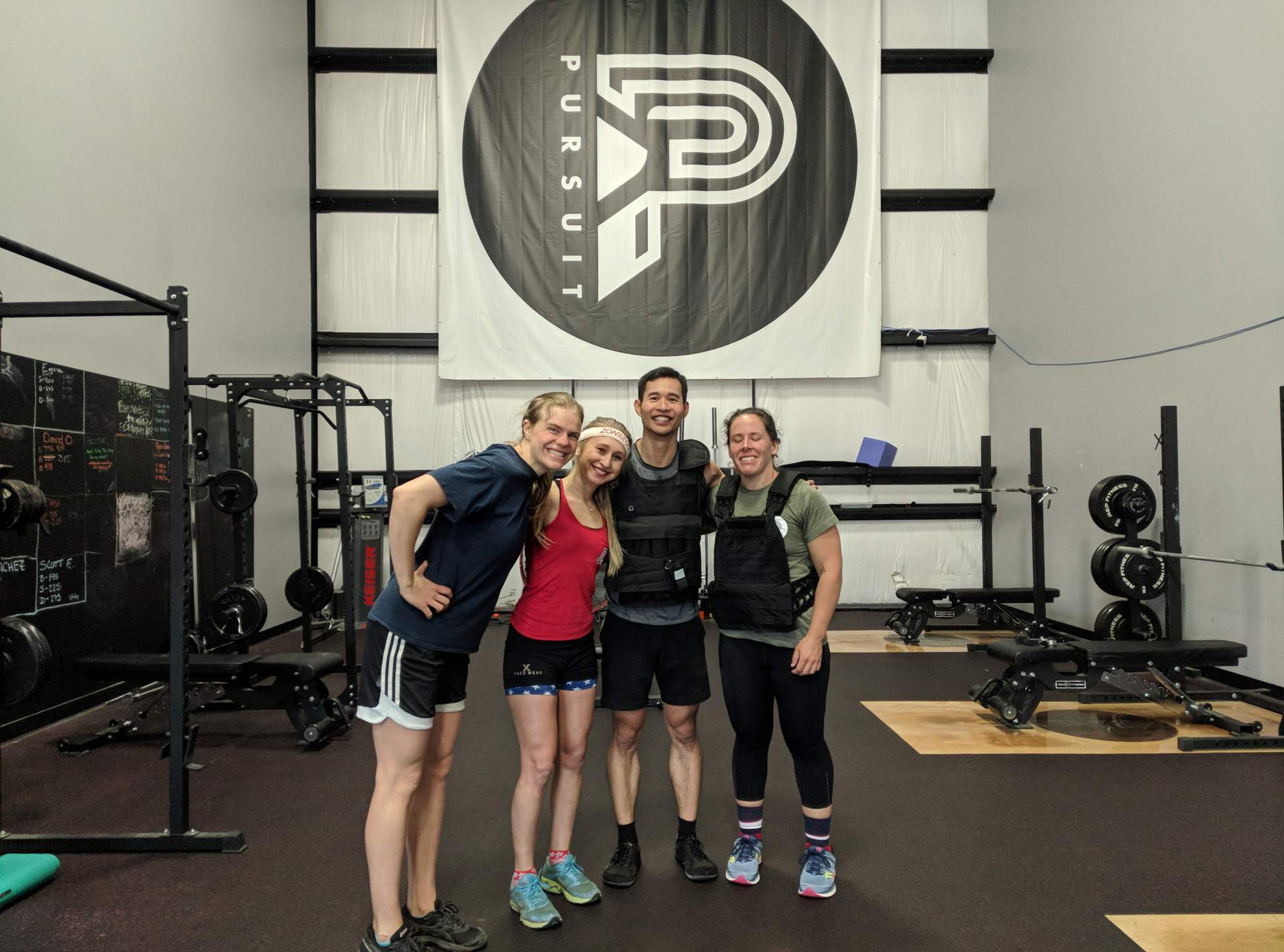Evelyn, Emily, Felix, and Jennifer at Pursuit Nutrition & Fitness for the Murph Challenge.