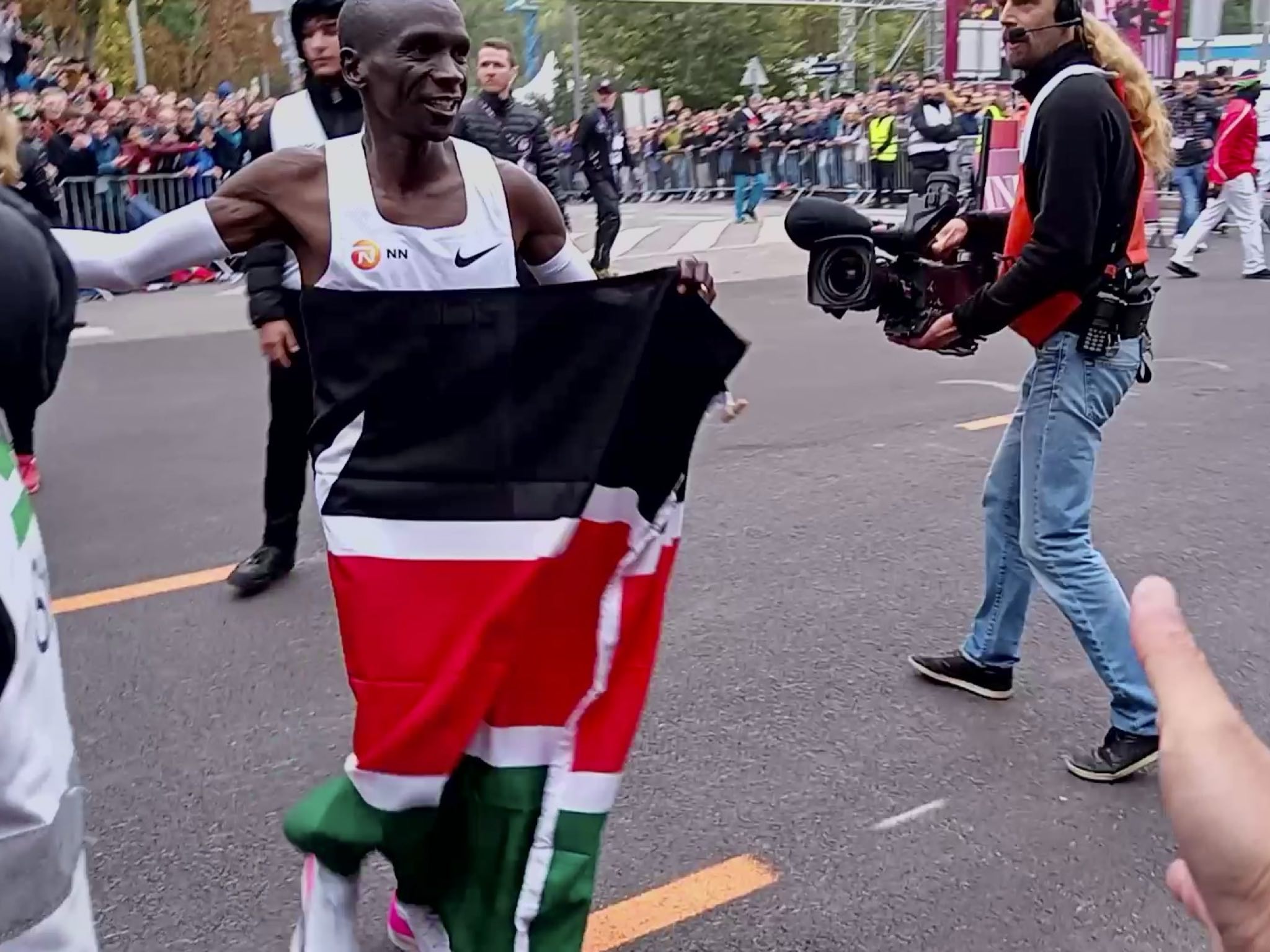 Eliud Kipchoge a meter in front of my outstretched hand two minutes after running the world's first sub-2-hour marathon.