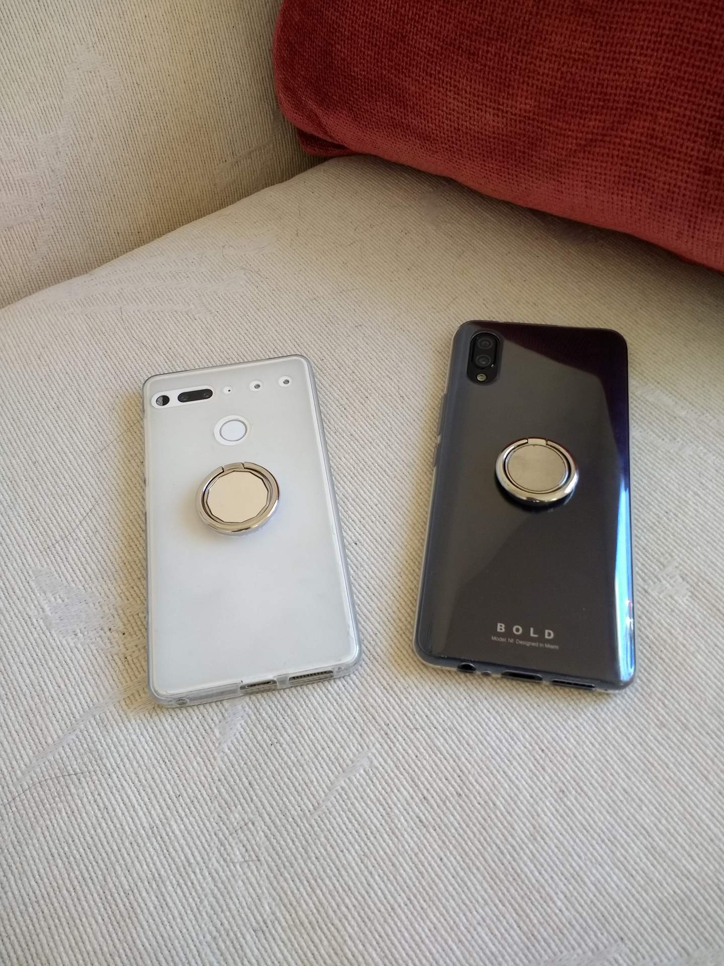 White Essential PH-1 (2017), black Bold N1 (2019) phones with ring stands