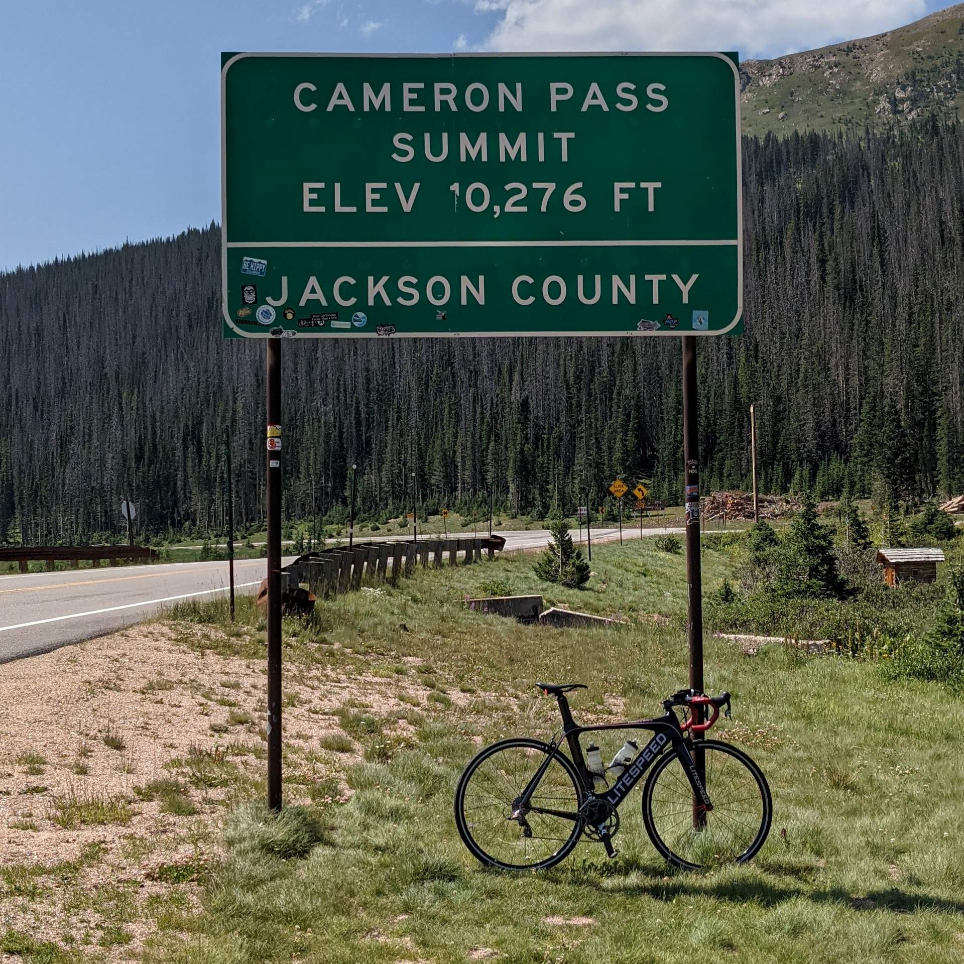 black Litespeed Archon C2, "Cameron Pass Summit Elev 10276 ft" sign
