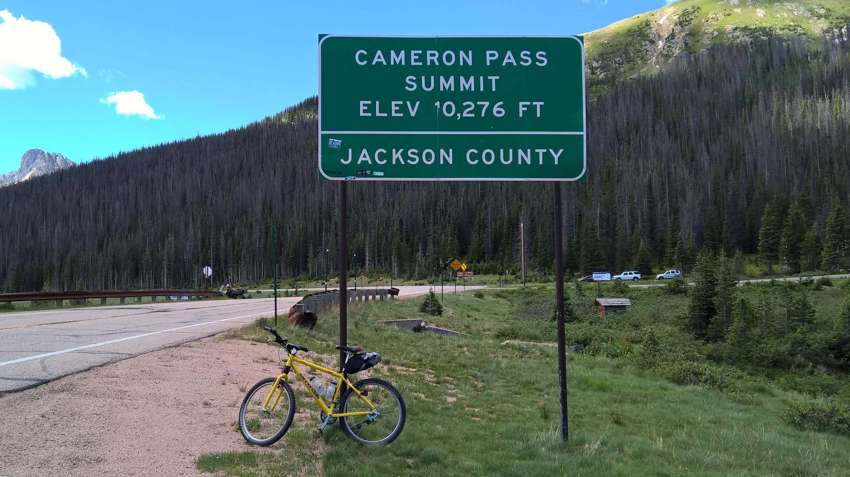 My yellow 1996 Cannondale F700 mountain bike at the summit of Cameron Pass.
