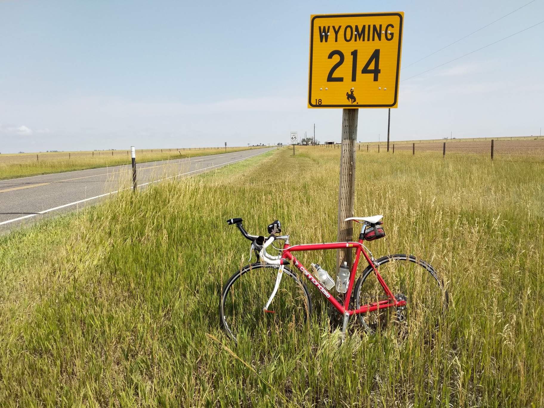 Red 1992 Cannondale 3.0 with a Wyoming 214 sign.