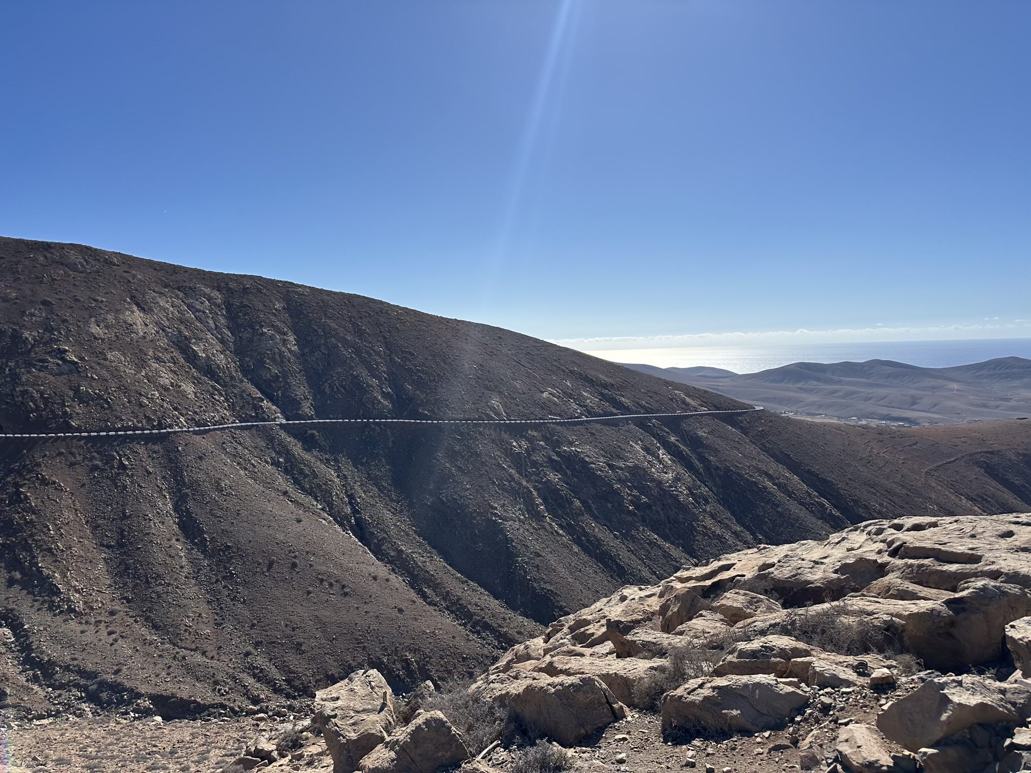 The highway I drove on. The Atlantic Ocean can be seen beyond all the volcanic rock.