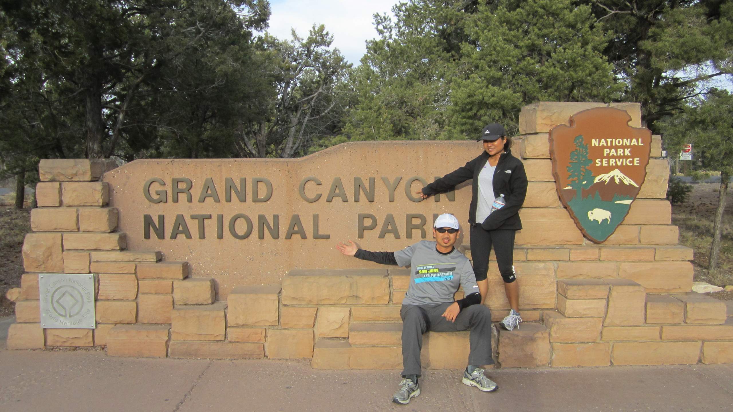 Bandy and Sara in front of the Grand Canyon National Park sign.