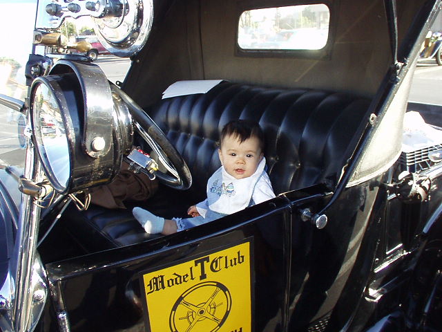 Back at the Sears/Fuddrucker's parking lot, here's little Emmalee in the driver's seat of Robert's Model T.  She's just 9 months old and already she wants to drive!