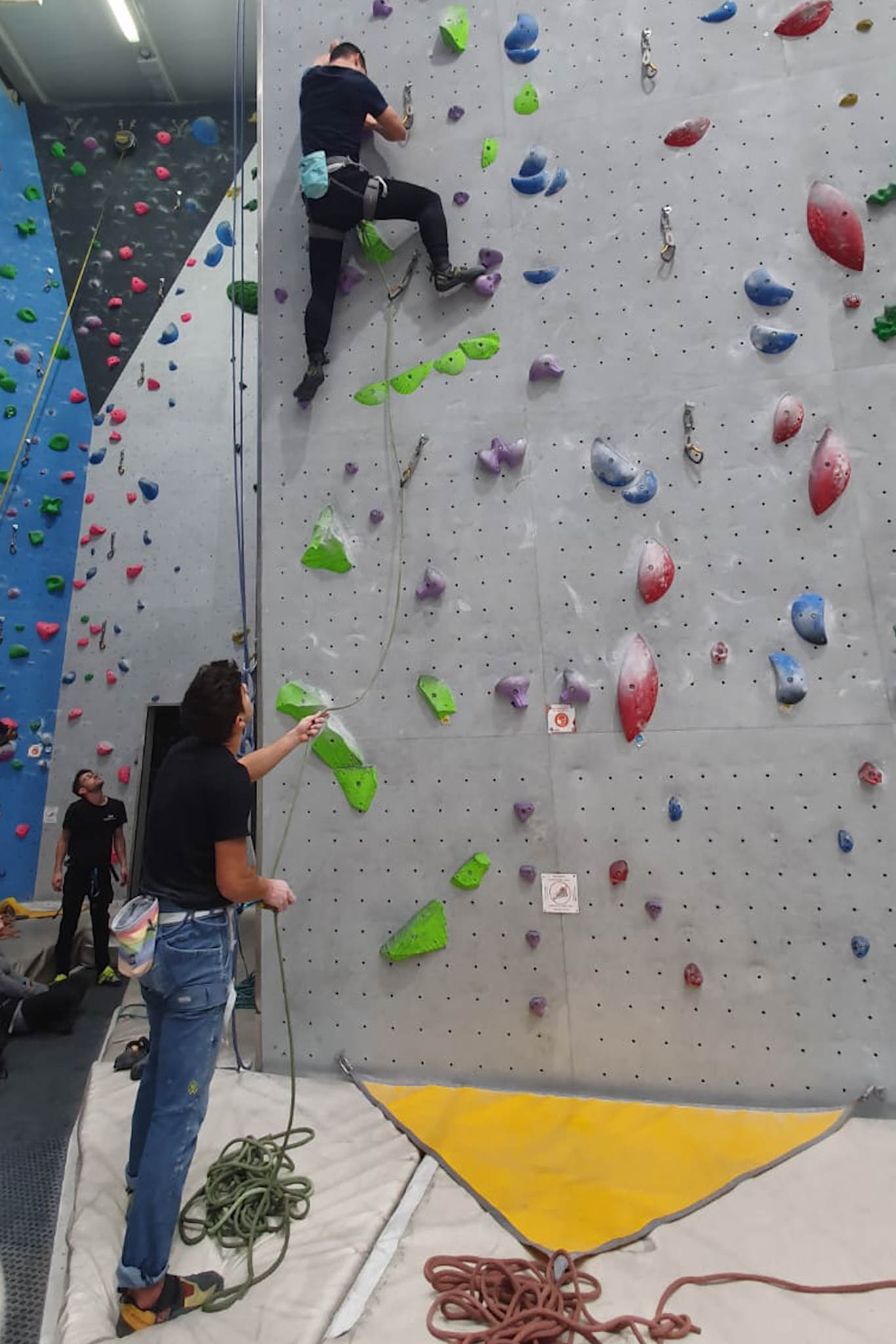 Felix leading a climb with a 5 rating, and Angel belaying.
