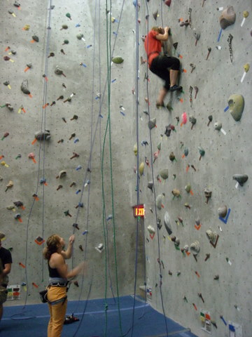 Erin on the wall with Tanya belaying below.