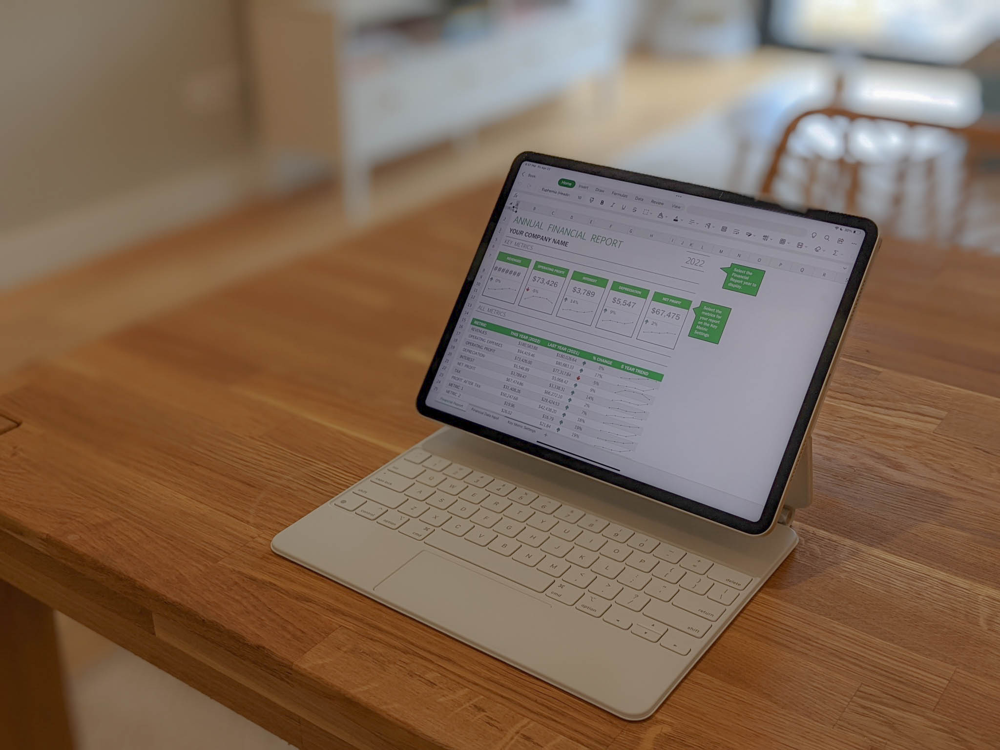 A white Apple iPad Pro 12.9 with an Annual Financial Report spreadsheet open in Microsoft Excel.