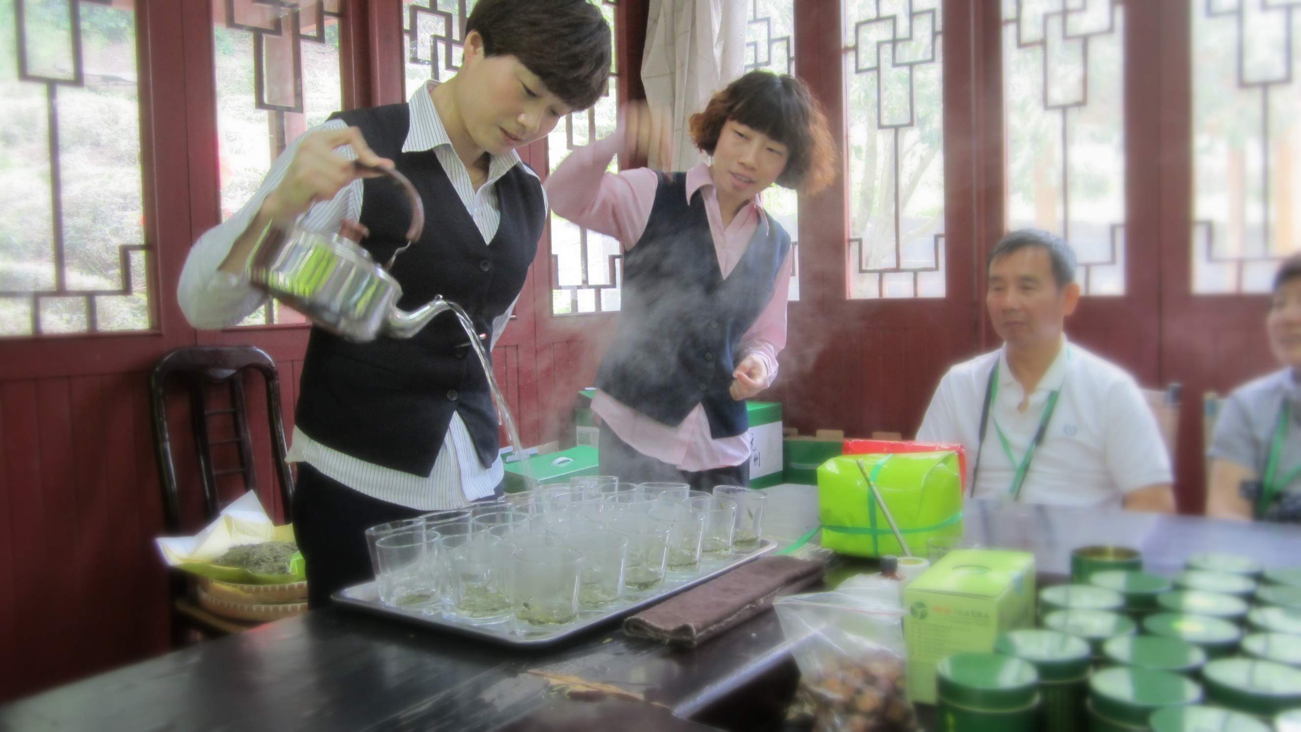 Two ladies touting the benefits of Longjing green tea.