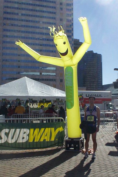 Photo: After the race we enjoyed some rice and beans, subways, and beer.  Here I am with the Subway blow-up dude.