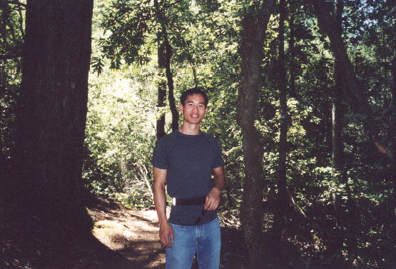 Felix Wong in a well-forested area, near our turnaround point.