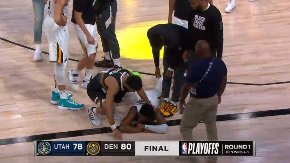 Bodies strewn on the floor at the end of the Utah vs. Denver Game 7 of the 2020 NBA playoffs.