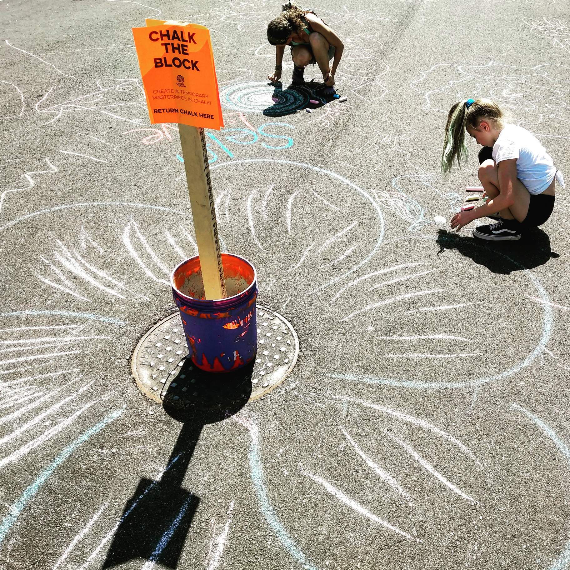 Two girls participating in "Chalk the Block."