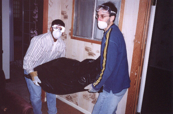 Here's fellow "Destroyers" Sam and Patrick taking out a bag of sheetrock, which used to be part of the ceiling!