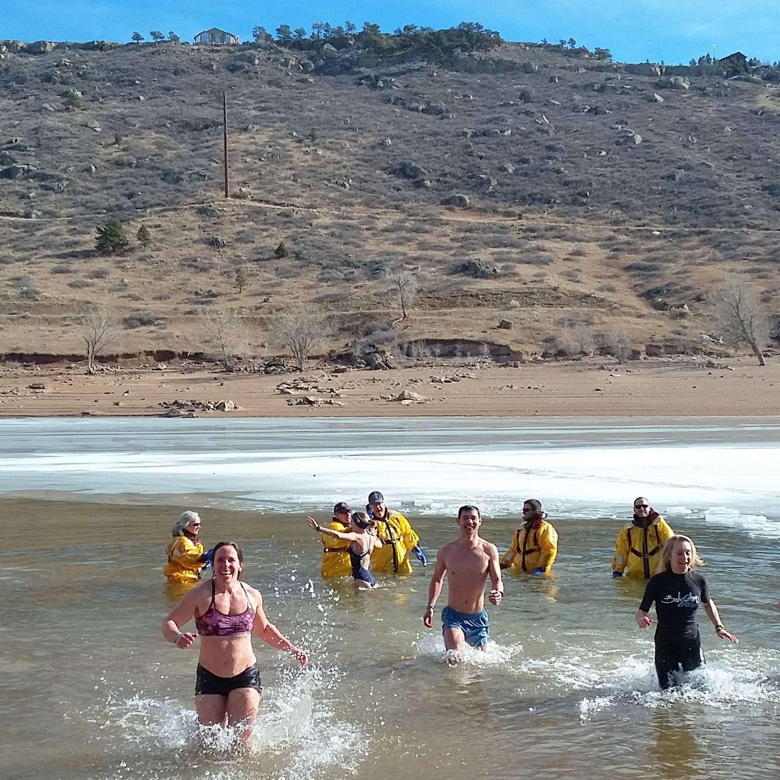 Jennifer, Felix and Emily emerging from the Horsetooth Reservoir at the 2019 Polar Bear Plunge.