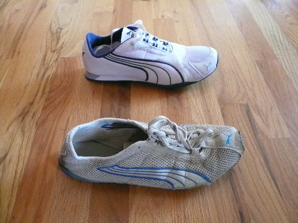 right white and black Puma H-Street shoe in foreground and new similar Puma Saloh shoe in background on hardwood floor.