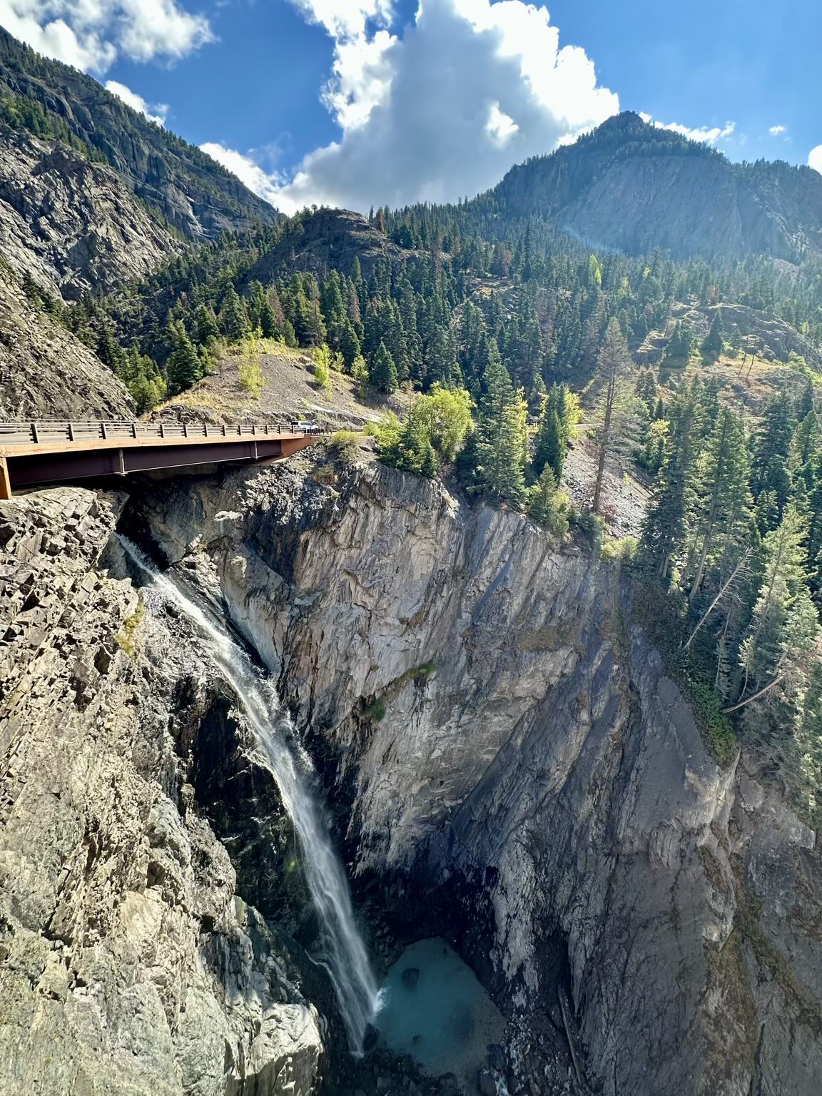 Bear Creek Falls plunges roughly 120 feet beneath the Million Dollar Highway (US Highway 550) before joining the Uncompahgre River.