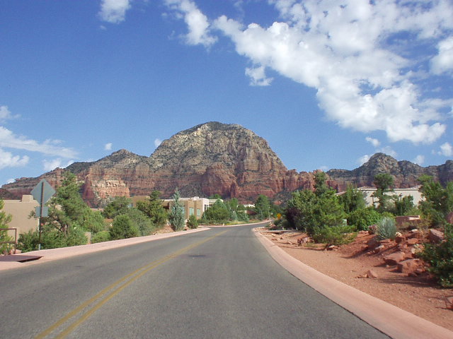Interesting formations of red rock surround the town of Sedona, which as has a lot of pine trees.