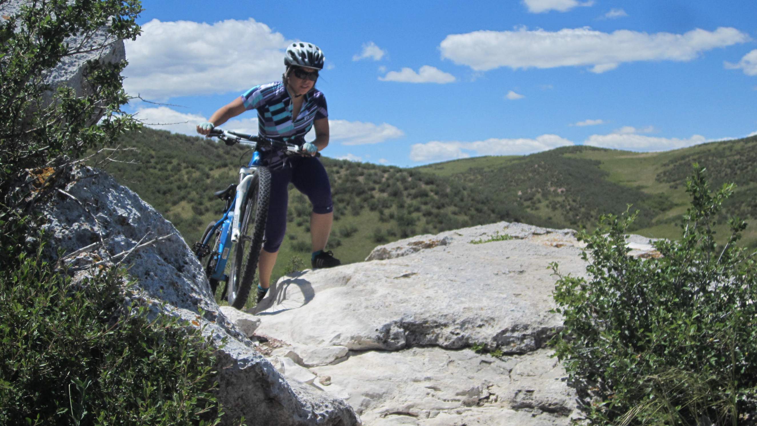 Lauren dismounting for a rocky section.