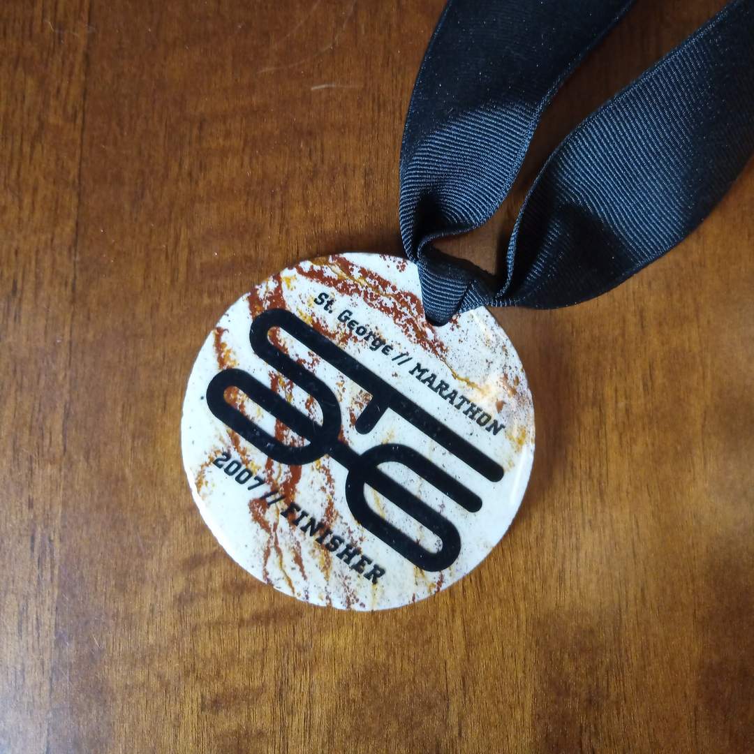 white medal that says St. George Marathon, 2007 finisher