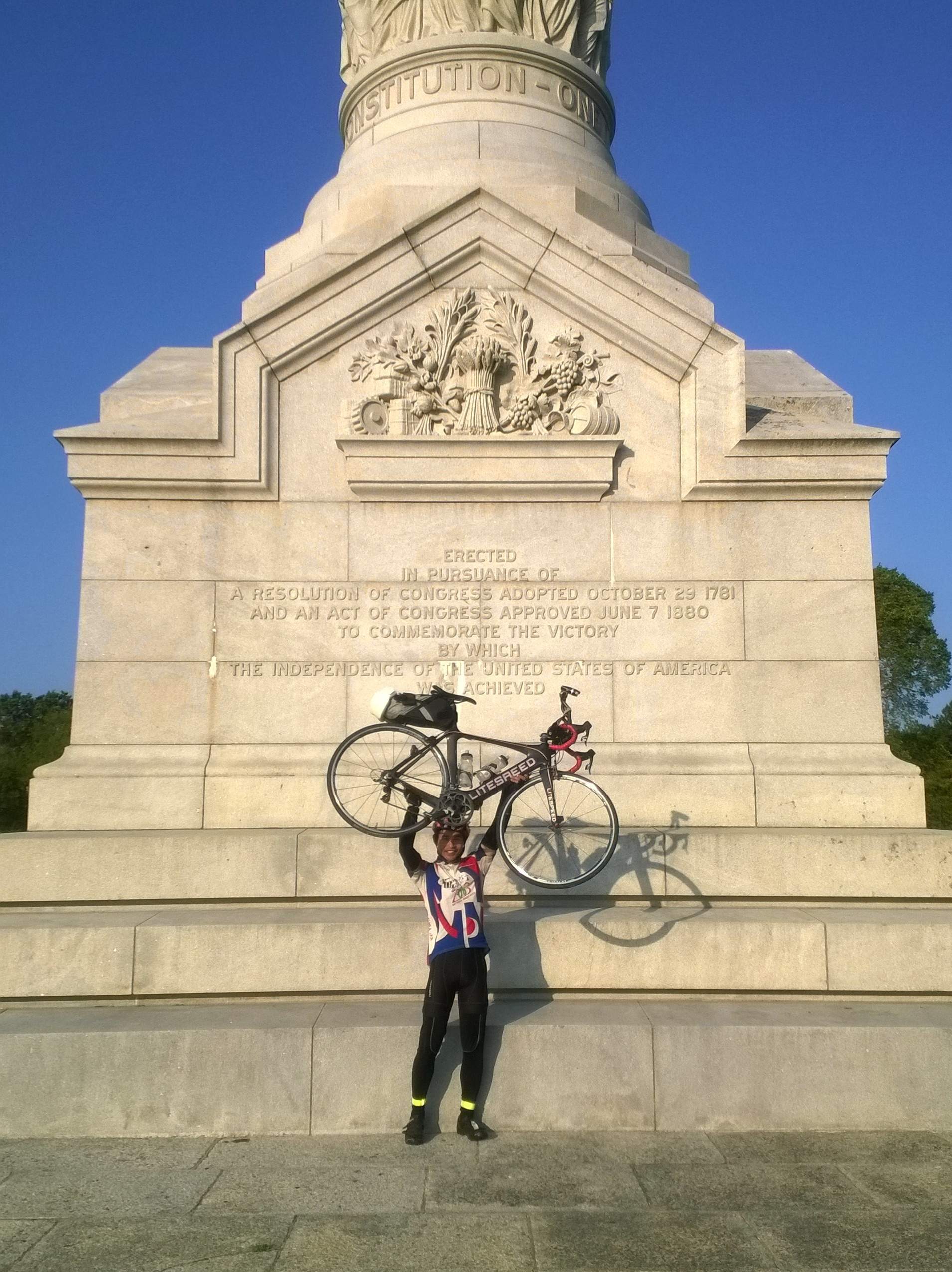 Felix Wong finishing the 2015 Trans Am Bike Race at the Yorktown Victory Monument in Virginia.