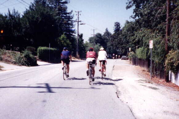 Jennie McCormick, David Hung, and Mark Rubin riding their bikes in the 1998 Tour du Jour.