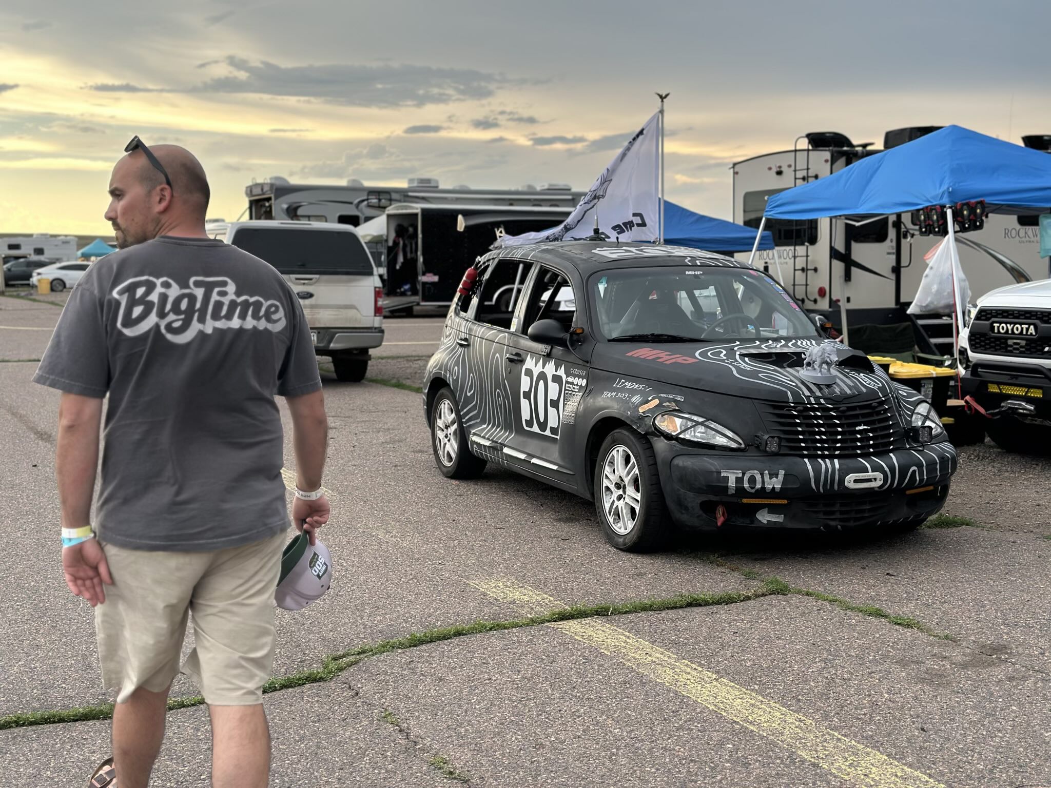 A black Chrysler PT Cruiser with a boar on the hood and a white flag. A black Chrysler PT Cruiser with a boar on the hood and a white flag.