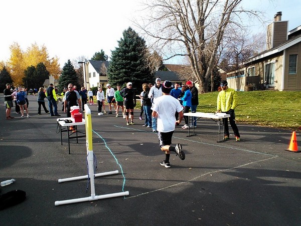 A runner crosses the finish line.