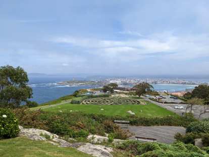 View of a maze (As Roseiras), the Orzan Cove, and the city of A Coruña.