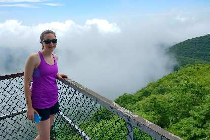 Maureen on the lookout tower at Albert Mountain and above the fog.