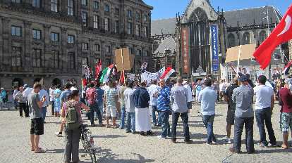 Some sort of protest was happening in front of the Royal Palace in Amsterdam.