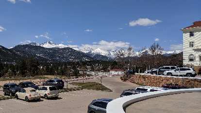 The view of the snow-covered Rocky Mountains from the Stanley Hotel in Estes Park.