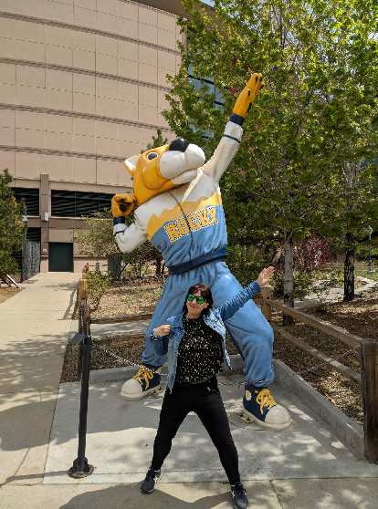 Vicky with the Rocky mascot for the Denver Nuggets at the Pepsi Center.