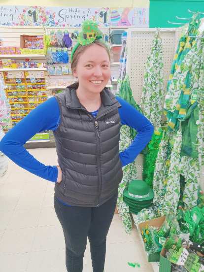Maureen modeling a St. Patrick's Day hat in the Dollar Tree we stopped by.