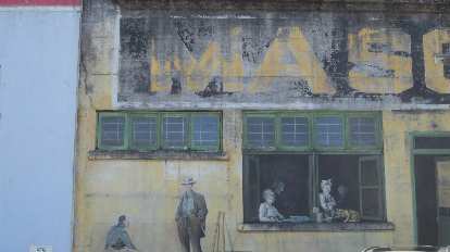 Mural on building in Astoria, Regon. yellow and green mural on building in Astoria, Oregon