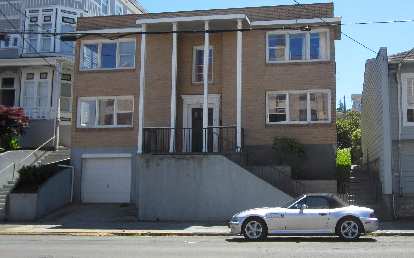 A silver 2000 BMW Z3 2.3 in front of a brown house in Astoria, Oregon. silver 2000 BMW Z3 2.3, brown house, Astoria, Oregon