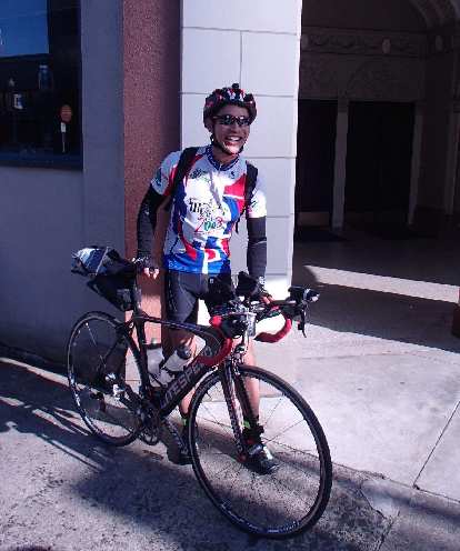 Felix Wong and his black Litespeed Archon C2 in Astoria, Oregon, the day before starting the 2015 Trans Am Bike Race. Photo: Corey Harn. Felix Wong, black Litespeed Archon C2, blue white red cycling jersey, Trans Am Bike Race, Astoria, Oregon